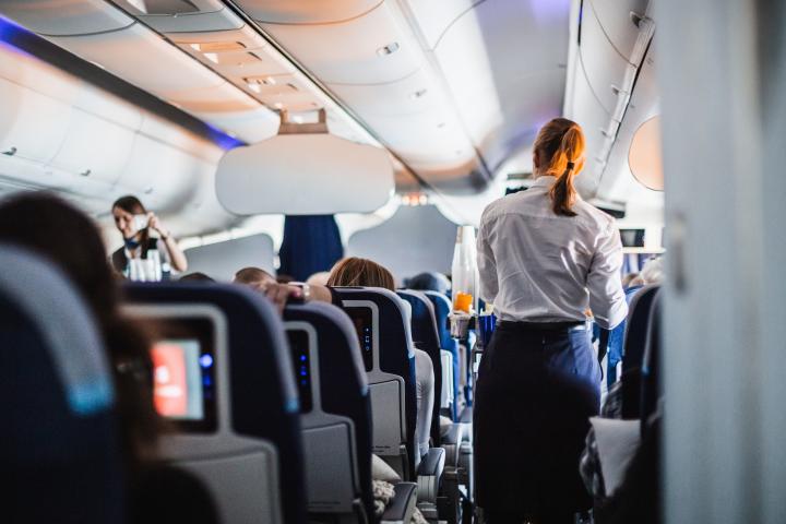 interior airplane passengers seats stewardess 123319504